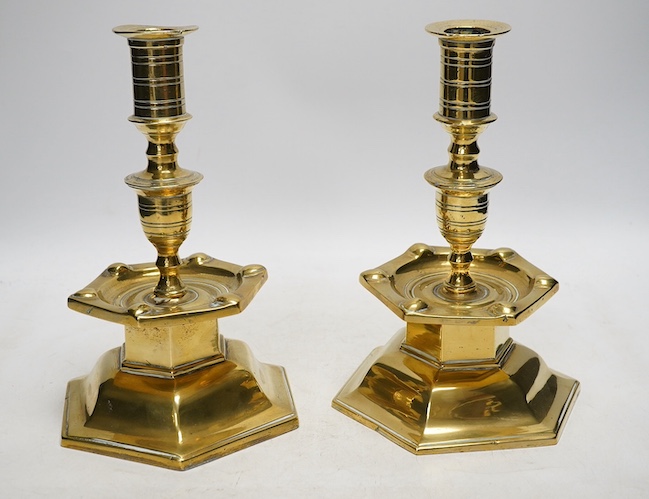 A pair of Dutch style 'Heemskerk' heavy cast brass candlesticks, on hexagonal bases, 24cm. Condition - fair to good